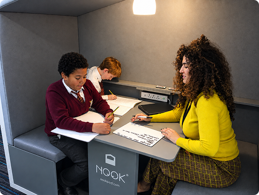 Image of children with teacher in a Nook